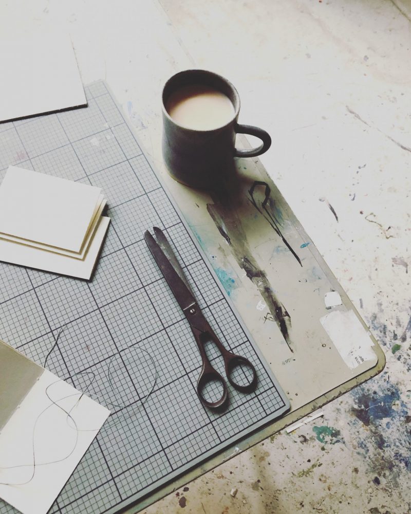 The Travelling Bookbinder film shoot. Bookbinder at work, with tea