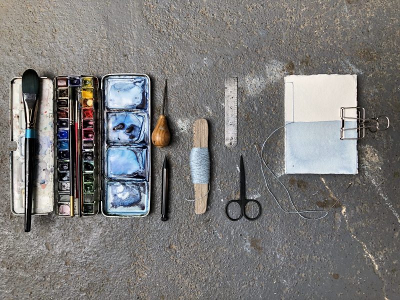 Make a stab binding with The Travelling Bookbinder - Down to middle hole