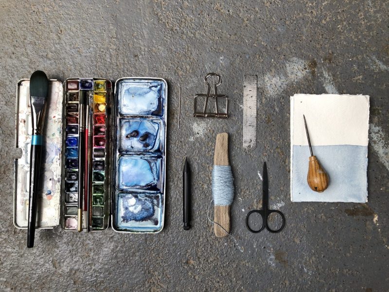Make a stab binding with The Travelling Bookbinder - Prick sewing holes with awl