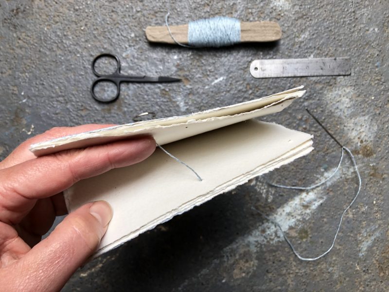 Make a stab binding with The Travelling Bookbinder - Start in the middle