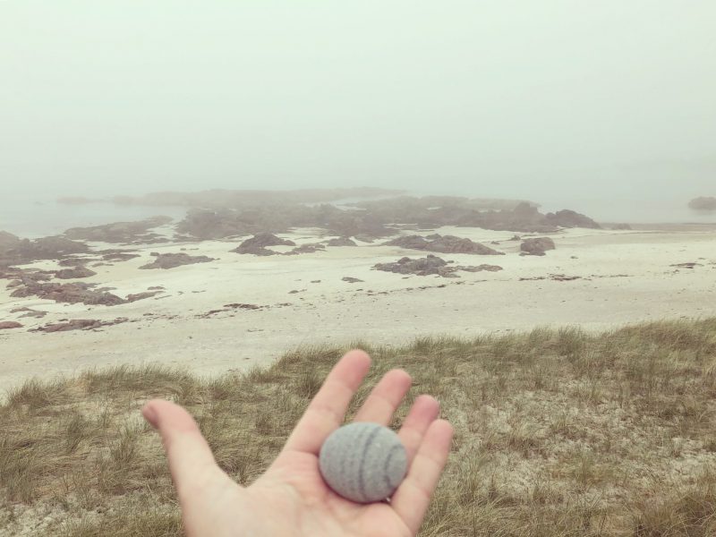 Carrying a pebble. Isle of Iona. Inner Hebrides. Island isolation: Creative lockdown.