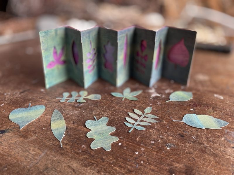 The Travelling Bookbinder: Cut Collage Concertina. Finished piece with three valleys sewn with pamphlet stitch