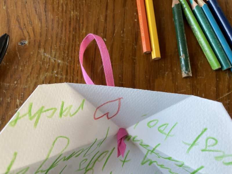 The Travelling Bookbinder: Folded pocket decoration: Add hanging ribbon