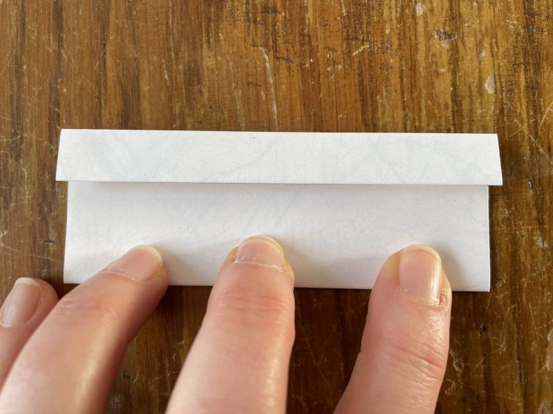 The Travelling Bookbinder: Origami Heart Ring: Turn 180 degrees and repeat.