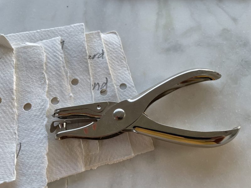 The Travelling Bookbinder: How to be Blue: Bookart project: Punch one hole in each sheet